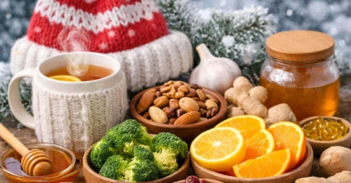 أطعمة تعزز المناعة في الشتاء مثل الشاي الدافئ، العسل، الزنجبيل، الثوم، المكسرات، البروكلي والحمضيات على طاولة شتوية.
